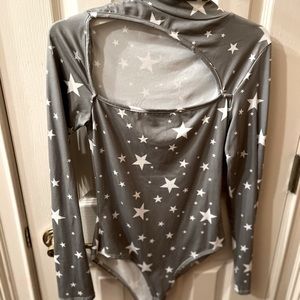 Beautiful leo only wore once. It has an open slit in the front.